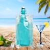 Sac rafraîchisseur Ice.Bag Classic transparent avec une bouteille dans un décor de plage